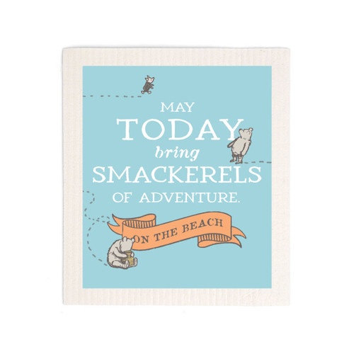 A blue biodegradable dish cloth that says "May Today bring Smackerels of Adventure on the Beach" with several small images of Pooh and Piglet.