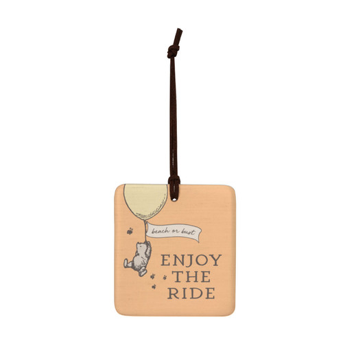 A square orange hanging tile magnet ornament that says "Enjoy The Ride", with an image of Pooh hanging from a balloon that says "beach or bust".