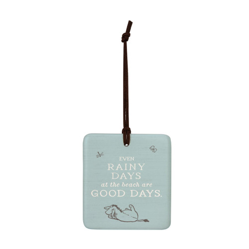 A square light blue hanging tile magnet ornament that says "Even Rainy Days at the beach are Good Days", with an image of Eeyore at the bottom.