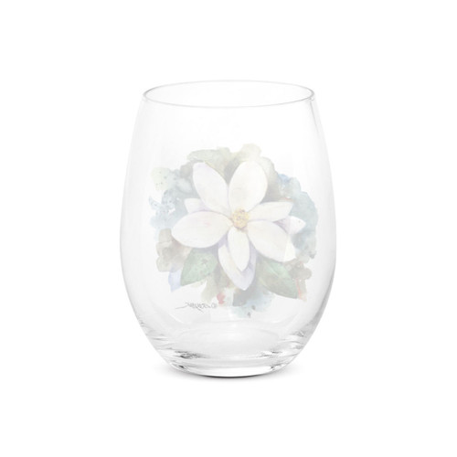 Back view of a clear stemless wine glass with a watercolor image of a white magnolia.