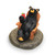 Small black bear figurine holding red cup with lime - sitting in wood chair on a round base that says "Its 5 o clock somewhere".
