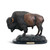 A carved sculpture of a standing bison mounted on a black base with a gold plaque that says "Tatanka America's National Mammal".