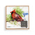 A square wood tic tac toe board with a watercolor image of a cardinal, displayed in a packaging box with a product information tag.