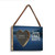 A rectangular wood hanging ornament with a 2 inch heart shaped opening for a photo next to the saying "Love Lake Nights" on a dark blue background, displayed angled to the right.