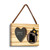 A rectangular wood hanging ornament with a 2x2 inch heart shaped photo opening next to an image of a black bear peeking over a wood stump with Utah on it, displayed angled to the right.