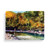 A 24 piece postcard puzzle with a watercolor image of a fisherman in a stream.