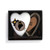 Heart shaped keeper with the image of a black bear peeking over a tree stump with Maine on it, displayed in a packaging box.