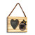 A rectangular wood hanging ornament with a 2x2 inch heart shaped photo opening next to an image of a black bear peeking over a wood stump with Colorado on it, displayed angled to the right.