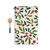 A cream kitchen towel with holly leaves and red berries next to a wood spoon with a green handle, shown with the towel laid out in full.