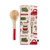 A tan kitchen towel with red and green tools for holiday baking next to a wood spoon with a red handle.