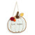 White pumpkin shaped wood hanging door decoration that says "Give Thanks" with three colored yarn poms".