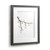 A gray wood framed image of a tree branch with two birds and flowers made of pebbles, displayed angled to the right.