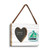 A rectangular hanging white wood frame ornament with a graphic image of a green sailboat with a 2x2 heart shaped opening for a photo, displayed angled to the right.