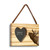 A rectangular wood hanging ornament with a heart shaped 2 inch photo opening next to an image of an elk, displayed angled to the right.