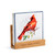 A square oil diffuser with a watercolor image of a red cardinal on it set in a wood stand that says "relax, renew, refresh", displayed angled to the right.