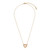 A gold chain necklace with a heart shaped charm filled with small cream stones.