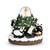 A musical snow globe with a black bear family in a Nativity scene among evergreens with a star in a glass ball at the top, displayed angled to the right.