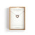 A silver chain necklace with a heart shaped charm filled with small pink stones, displayed in a packaging box.
