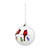 A clear glass ball ornament with an image of two cardinals sitting on a holiday string of lights, displayed angled to the left.