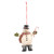 A hanging ornament of a snowman wearing boots, top hat, green mittens and a scarf while holding a candy cane.