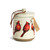 A cream ceramic candle with watercolor cardinals around the outside and a removable lid, displayed with a product tag attached.