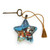 A blue star shaped sculpture with an image of Santa and his sleigh. The star has a gold tassel and gold key attached.