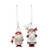 Two different holiday gnomes ornaments dressed in red and white outfits, carrying toys.