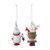 Back view of two different holiday gnomes ornaments dressed in red and white outfits, carrying toys.