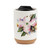 A white travel mug with a cork base, a black lid, and a watercolor image of an American dogwood.