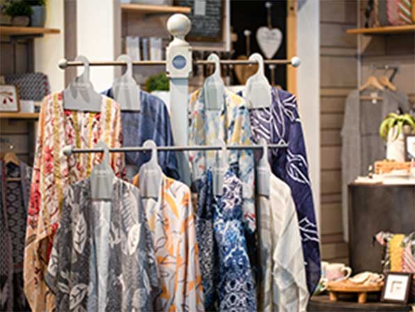 Fashion scarves hanging on display in a store