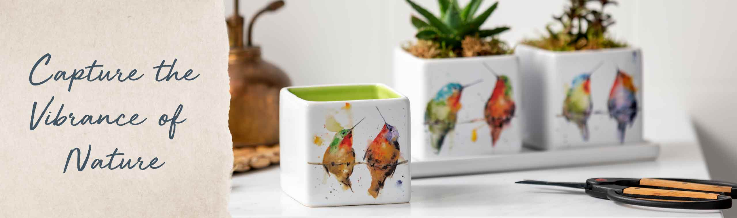 Capture the Vibrance of Nature. Set of three planter pots decorated in colorful watercolor birds.