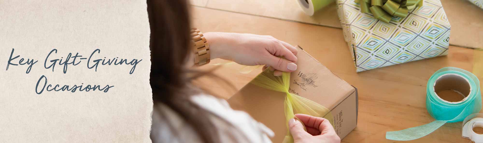 Key Gift Giving Occasions. Woman wrapping a gift box.