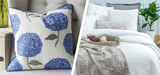 Picture of Hydrangea Pillow and William & Mary White matelassé bedding.