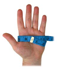 man's hand with tape measure wrapped around