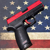 a red SIRT laser pistol on American Flag mat