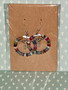 beaded hoop earrings with key charm. multicolor jasper beads.