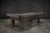 Rustic wood billiards table by Brixton Billiards.