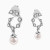LDE1026 - Stars Swirl Pearl & Diamond Stud Earrings in 18K Gold - 144201101981001-4.webp