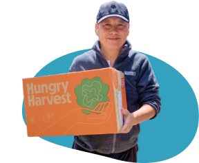 Hungry Harvest Worker holding a package