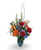 Shop Aqua Ember, a bold fall flower arrangement featuring blue hydrangea, delphinium, orange lilies and roses. Available from Rose & Blossom in Spokane.