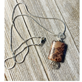 handcrafted pendant of crazy horse jasper with a swirl