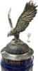 Ornamental pewter lid topped with a finely crafted pewter eagle figurine, wings spread wide.