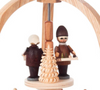 Authentic German Pyramids ON SALE! | Features handcarved Santa with 3 children holding lanterns on the lower turntable, 2 merchants with tray of trinkets on the upper turntable, intricate trees throughout, and 4 premium brass tealight candle holders. USE: Place the candle in the designated holders on the pyramid. Heat from the candle will slowly cause the blades to rotate. | 2-Tier Lantern Children and Merchants, 9" 085/P/530/D | Handmade in the Erzgebirge region of Seiffen, Germany | Lindenhaus Imports in Helen, Ga