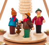 Authentic German Pyramids ON SALE! | Features three handcrafted woodsmen: 1 carrying kinlin, 1 loading the wood onto the sled, and 1 holding the rope to the sled; intricate rotating tree in center, and 4 brass tealight candle holders. USE: place the candle in the designated holders on the pyramid. Heat from the candle will slowly cause the blades to rotate. | 1-Tier Waldleuten (Woodsmen), 10" 085/P/484/D/5 | Handmade in the Erzgebirge region of Seiffen, Germany | Lindenhaus Imports in Helen, Ga