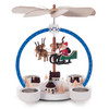 Authentic German Pyramids ON SALE! | Features blue arch with white polka dots, flying Santa with 3 handcarved reindeer floating in center, 5 mini houses, intricate trees throughout, and 4 premium metal tealight candle holders. USE: Place the candle in the designated holders on the pyramid. Heat from the candle will slowly cause the blades to rotate. | 2-Tier Winterzauber (Winter Magic), 9" Polka Dot Arch 085/P/842/D | Handmade in the Erzgebirge region of Seiffen, Germany | Lindenhaus Imports in Helen, Ga