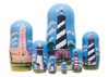 FRONT: each piece includes a handcrafted replica of 7 beloved American lighthouses including Cape Hatteras, NC; Alcatraz, CA; St. Augustine, FL; Barnegat, NJ; Assateague Light, VA; Montauk, NY; and Cape Canaveral, FL || 7-Piece Lighthouses of America Matryoshka, 8" Nesting Doll 151074 || Lindenhaus Imports