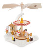 Authentic German Pyramids! | Features 4 handcarved snowmen including one holding a heart-shaped sign with "Ich hab dich liebe" (German for "I love you"), forest animals, and carnival cart on the lower turntable, 4 glass tealight candle holders, snowflake pattern on wooden blades | Exclusive 1-Tier Snowman Carousel Pyramid, 11" 085/P/895/W | Handmade in the Erzgebirge region of Seiffen, Germany | Lindenhaus Imports in Helen, Ga