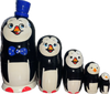 Handcrafted Matryoshka Stackable Nesting Dolls ON SALE! | FRONT: 5 stackable wooden black and white penguin dolls with bright blue eyes, orange beak, a hand-painted blue and white polka-dot bow and 3D blue hat on the largest piece | Penguin Matryoshka with Blue Top Hat, 7" | Lindenhaus Imports in Helen, Ga