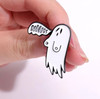 'BOOOOBS' Ghost Enamel Pin HP-37 being held in-between a woman's thumb and index finger
