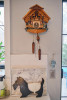Decorative view of the Rheinberg Musical Chalet German Quartz Cuckoo Clock on living room wall